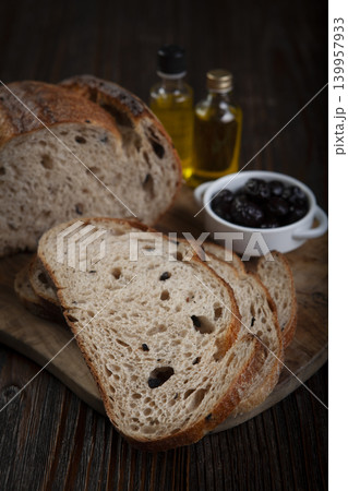 Rustic Olive Bread Presentation on Wood Background. 139957933