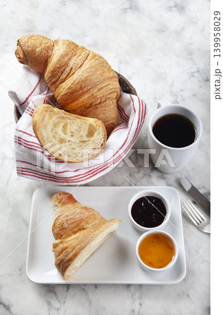 Croissant, Coffee and Jam on Marble Surface.  139958029