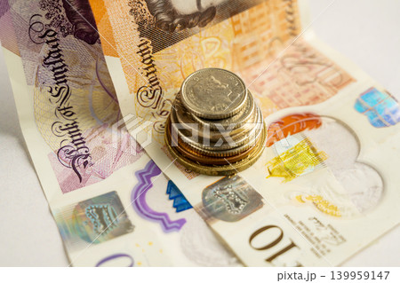 Banknotes and coins close-up, personal finance savings budgeting and cash payment concept Banknotes and coins close-up, personal finance savings budgeting and cash payment concept 139959147