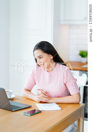 Woman working with laptop computer at home 139959609