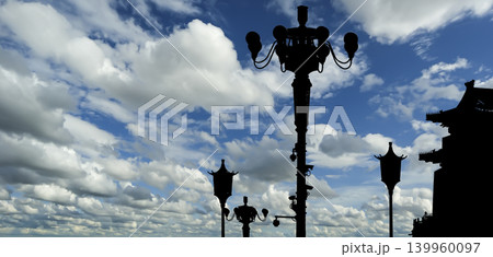 Street lamp on Tiananmen Square in Beijing, China (against the background of a beautiful sky with clouds), with propaganda or public announcement speakers Street lamp on Tiananmen Square in Beijing, China (against the background of a beautiful sky with clouds), with propaganda or public announcement speakers 139960097
