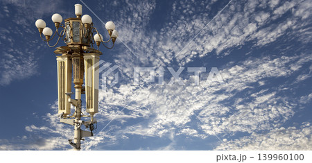Street lamp on Tiananmen Square in Beijing, China (against the background of a beautiful sky with clouds), with propaganda or public announcement speakers Street lamp on Tiananmen Square in Beijing, China (against the background of a beautiful sky with clouds), with propaganda or public announcement speakers 139960100