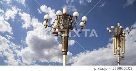 Street lamp on Tiananmen Square in Beijing, China (against the background of a beautiful sky with clouds), with propaganda or public announcement speakers 139960102