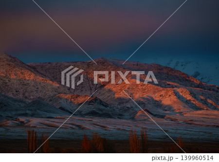 Picturesque mountain winter landscape at red sunset light Picturesque mountain winter landscape at red sunset light 139960514