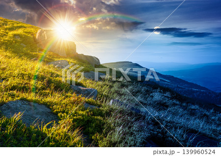 mountain landscape on summer solstice. day meet night. beautiful outdoor scenery of carpathian mountains. sun and moon over grassy slopes with rocks. astrology image for ukraine travel concept mountain landscape on summer solstice. day meet night. beautiful outdoor scenery of carpathian mountains. sun and moon over grassy slopes with rocks. astrology image for ukraine travel concept 139960524