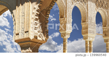 Arches in Islamic (Moorish) style (against the background of a beautiful sky with clouds) in Alhambra, Granada, Spain 139960540