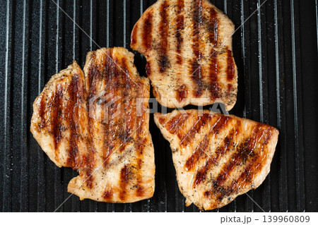 Grilled Turkey Steaks with Perfect Brown Grill Marks Close-up Grilled Turkey Steaks with Perfect Brown Grill Marks Close-up 139960809