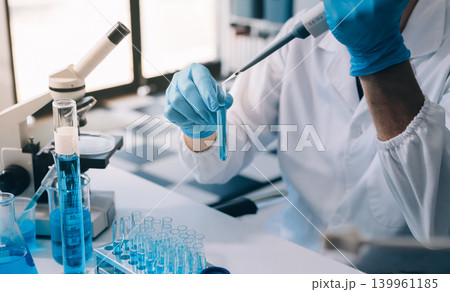 Lab technician experimenting in lab Lab technician experimenting in lab 139961185