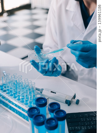 Lab technician experimenting in lab Lab technician experimenting in lab 139961186