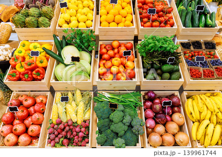 Stalls vibrant fruits vegetables in rustic farm market, inviting shoppers to explore fresh produce. Stalls vibrant fruits vegetables in rustic farm market, inviting shoppers to explore fresh produce. 139961744