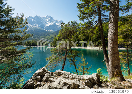 Travel landscape of Eibsee lake and Zugspitze Alps in Bavaria Germany, scenic summer nature panorama with forest, snow mountains peak Travel landscape of Eibsee lake and Zugspitze Alps in Bavaria Germany, scenic summer nature panorama with forest, snow mountains peak 139961979