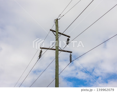 Wooden telephone poles against a vibrant blue sky in the Blue Mountains Wooden telephone poles against a vibrant blue sky in the Blue Mountains 139962079