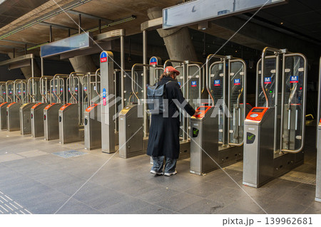 Amsterdam, Netherlands, 22.04.2026 - Passenger using electronic ticket gate inside Amsterdam metro station Amsterdam, Netherlands, 22.04.2026 - Passenger using electronic ticket gate inside Amsterdam metro station 139962681