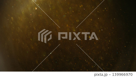 Twinkle blur confetti. Flare glimmer. Yellow gray mixing flow. Golden shimmering light color particles on dark abstract background. Twinkle blur confetti. Flare glimmer. Yellow gray mixing flow. Golden shimmering light color particles on dark abstract background. 139966970