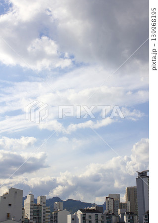 A view of the apartment and a sky with beautiful clouds A view of the apartment and a sky with beautiful clouds 139968195