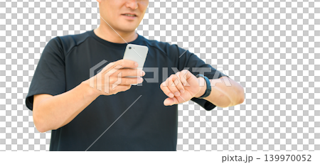 A middle-aged man in sportswear uses a smartwatch for health management and healthcare. A middle-aged man in sportswear uses a smartwatch for health management and healthcare. 139970052