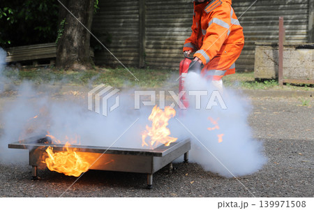 fire prevention. corporate safety - exercise during a firefighting course 139971508