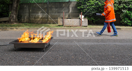 fire prevention. corporate safety - exercise during a firefighting course fire prevention. corporate safety - exercise during a firefighting course 139971513