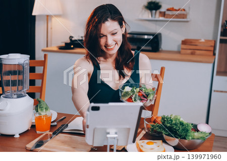 Woman preparing green smoothie in bright kitchen with fresh fruits and vegetables, healthy eating lifestyle moment in natural daylight Woman preparing green smoothie in bright kitchen with fresh fruits and vegetables, healthy eating lifestyle moment in natural daylight 139971960