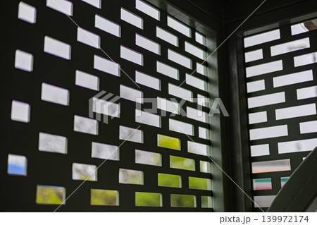Ventilation Wall Openings Air Flow Natural Light, A vivid close up of wall ventilation openings with light streaming through, ideal for architectural documentary and creative advertising. 139972174