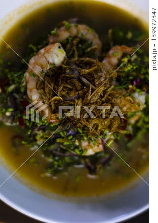 Neem Flower Shrimp Salad On Table, A vibrant photo of fresh neem flower shrimp salad on a table, capturing unique Thai flavors and natural ingredients, perfect for food documentary and culinary. Neem Flower Shrimp Salad On Table, A vibrant photo of fresh neem flower shrimp salad on a table, capturing unique Thai flavors and natural ingredients, perfect for food documentary and culinary. 139972347