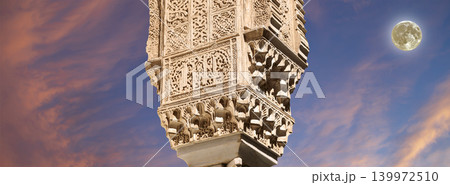 Columns in Islamic (Moorish) style in Alhambra (against the sunset with the super moon), Granada, Spain Columns in Islamic (Moorish) style in Alhambra (against the sunset with the super moon), Granada, Spain 139972510