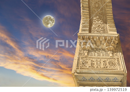 Columns in Islamic (Moorish) style in Alhambra (against the sunset with the super moon), Granada, Spain Columns in Islamic (Moorish) style in Alhambra (against the sunset with the super moon), Granada, Spain 139972519