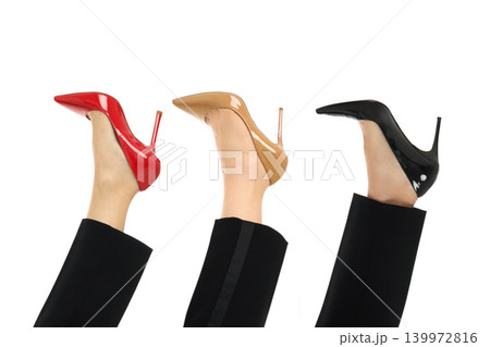 A woman displays high heel shoes in three colors, isolated, PNG A woman displays high heel shoes in three colors, isolated, PNG 139972816