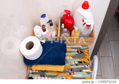 Bathroom Cleaning Supplies and Toilet Paper, towels. Bath room Essentials Stacked With Clean Bottles. Bathroom Cleaning Supplies and Toilet Paper, towels. Bath room Essentials Stacked With Clean Bottles. 139973234