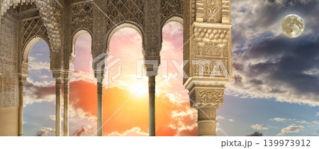 Arches in Islamic (Moorish) style (against the sunset with the super moon) in Alhambra, Granada, Spain 139973912