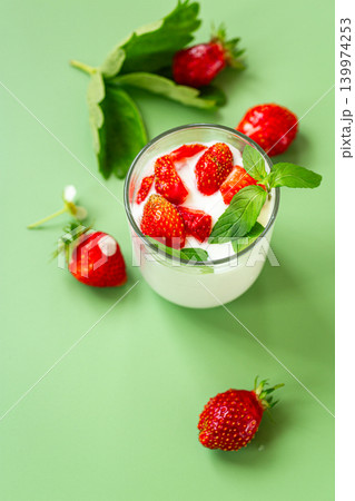 Fresh organic strawberries with yogurt and green mint 139974253