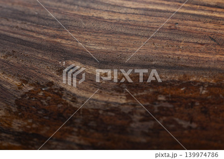 Water Stains On A Wooden Table Surface. Top down view of dried liquid marks and spilled spots on dark brown timber plank desk, ideal for home maintenance or interior cleaning concepts. Water Stains On A Wooden Table Surface. Top down view of dried liquid marks and spilled spots on dark brown timber plank desk, ideal for home maintenance or interior cleaning concepts. 139974786