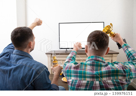 Kiev, Ukraine, March 25, 2026: Watching football with Corona Beer Kiev, Ukraine, March 25, 2026: Watching football with Corona Beer 139976151