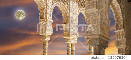 Arches in Islamic (Moorish) style (against the sunset) in Alhambra, Granada, Spain Arches in Islamic (Moorish) style (against the sunset) in Alhambra, Granada, Spain 139976304