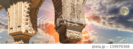Arches in Islamic (Moorish) style (against the sunset with the super moon) in Alhambra, Granada, Spain 139976366