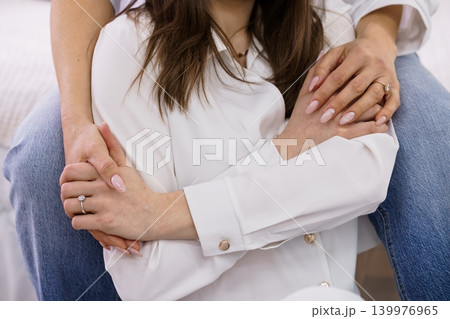 Couple Embracing in White Shirt and Blue Jeans Close up Lifestyle Portrait with Jewelry Couple Embracing in White Shirt and Blue Jeans Close up Lifestyle Portrait with Jewelry 139976965