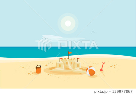 Sand Castle on Sandy Beach with Blue Sea Ocean and Clear Summer Sunny Sky 139977867