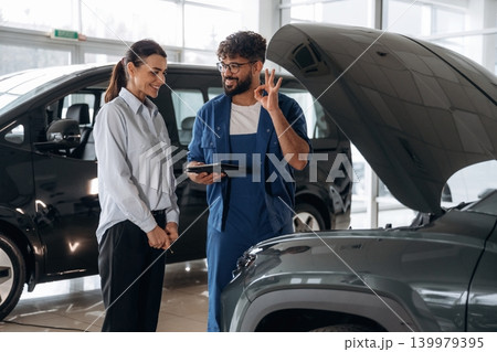 Technical inspection explained to customer indoors Technical inspection explained to customer indoors 139979395