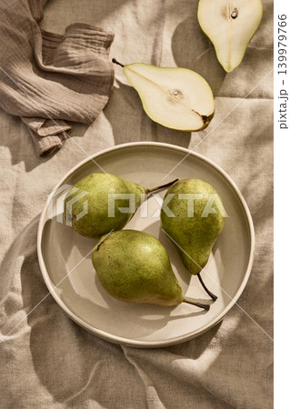Three Fresh Italian Pears on a Ceramic Plate. Top View 139979766