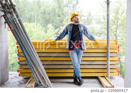 Construction worker planning on a building site Construction worker planning on a building site 139980417