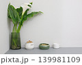 Fresh flowers and simple bowls on a gray table in a modern space 139981109
