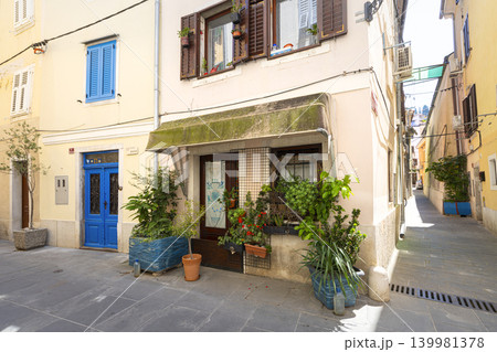 A quaint street scene features buildings with colorful doors and windows in Piran, Slovenia A quaint street scene features buildings with colorful doors and windows in Piran, Slovenia 139981378