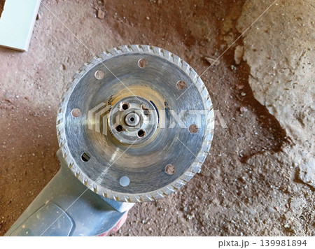 Close up of a grinder blade or saw blade for cutting ceramics. Close up of a grinder blade or saw blade for cutting ceramics. 139981894