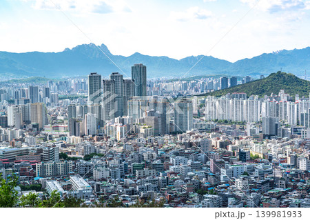 Seoul, South Korea - May. 08, 2026 : Panoramic view of the vast Seoul cityscape, Han River, and fluffy clouds under a clear blue spring sky from Yongmasan Mountain Seoul, South Korea - May. 08, 2026 : Panoramic view of the vast Seoul cityscape, Han River, and fluffy clouds under a clear blue spring sky from Yongmasan Mountain 139981933