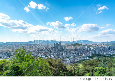 Seoul, South Korea - May. 08, 2026 : Panoramic view of the vast Seoul cityscape, Han River, and fluffy clouds under a clear blue spring sky from Yongmasan Mountain Seoul, South Korea - May. 08, 2026 : Panoramic view of the vast Seoul cityscape, Han River, and fluffy clouds under a clear blue spring sky from Yongmasan Mountain 139981935