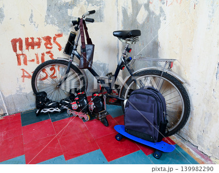 bicycle and sports equipment in the corner bicycle and sports equipment in the corner 139982290