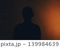 Person silhouette projecting on dark cinematic background 139984639