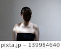 Woman's face obscured by shadow, mystery and anonymity 139984640