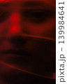 Abstract ghostly red face creating somber mood 139984641