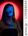 Woman meditating with closed eyes in ethereal light 139984644